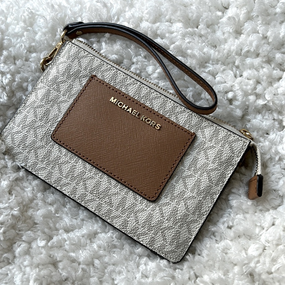 Michael Kors wristlet canvas purse cream and camel color.